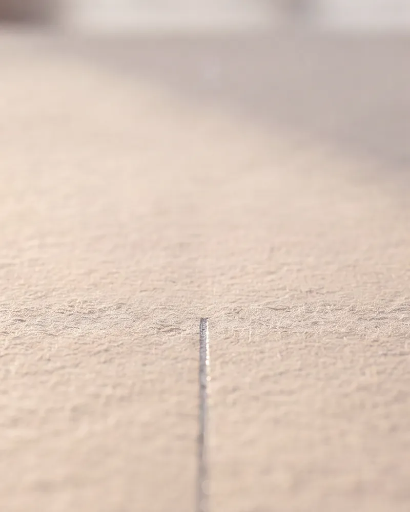 A single graphite line on drafting paper, where every project starts
